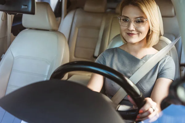 depositphotos_202261990-stock-photo-attractive-smiling-businesswoman-driving-car